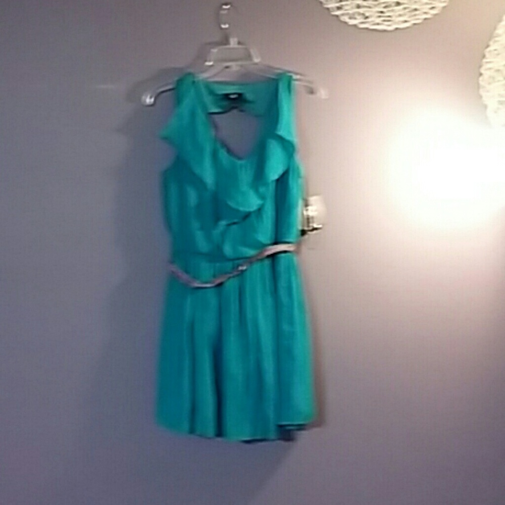 This lovely blue dress has a lovely back to it .